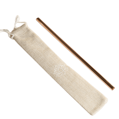 Single rose gold-colored metal straw with beige fabric storage pouch on white background