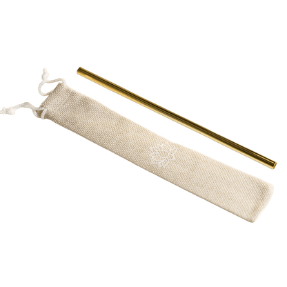 Single gold-colored metal straw with beige fabric storage pouch on white background