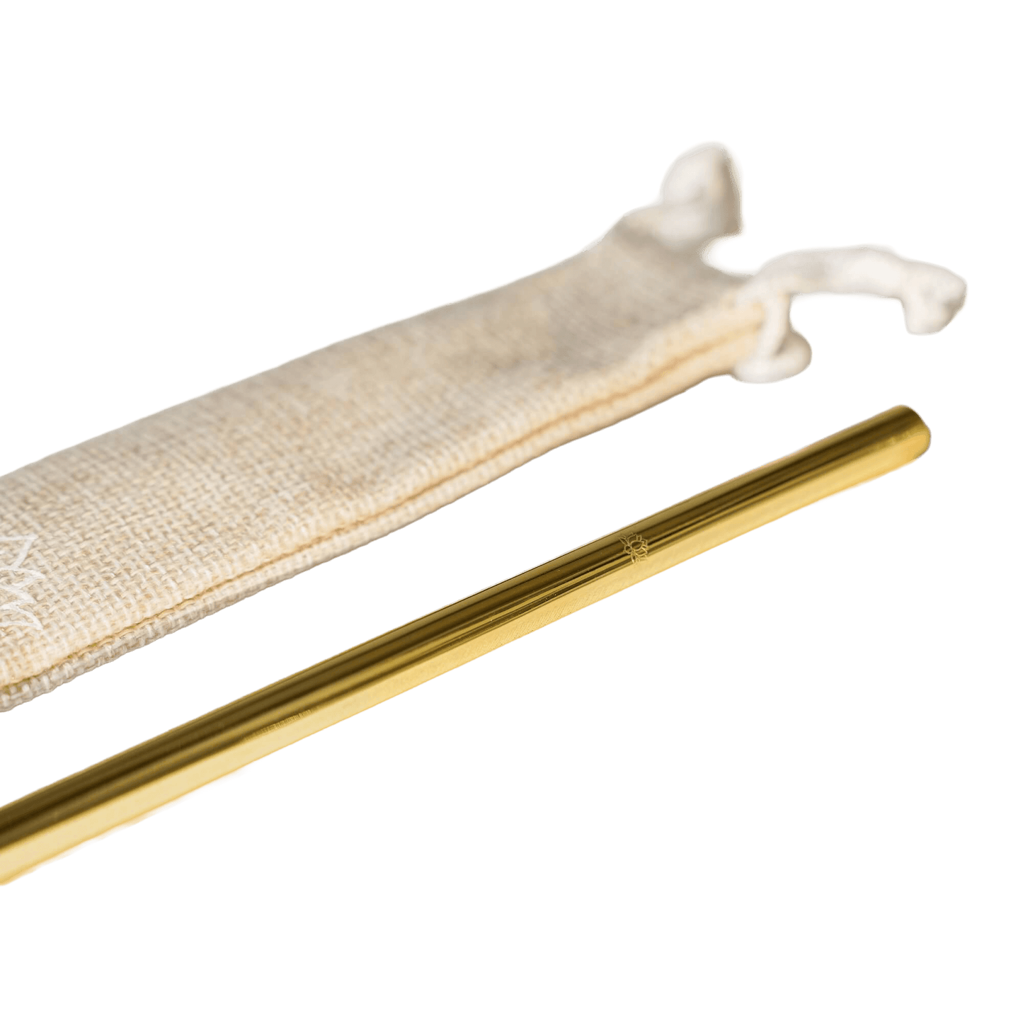 Close-up of gold metal straw partially inserted in beige drawstring storage pouch