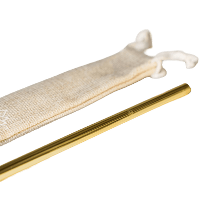 Close-up of gold metal straw partially inserted in beige drawstring storage pouch