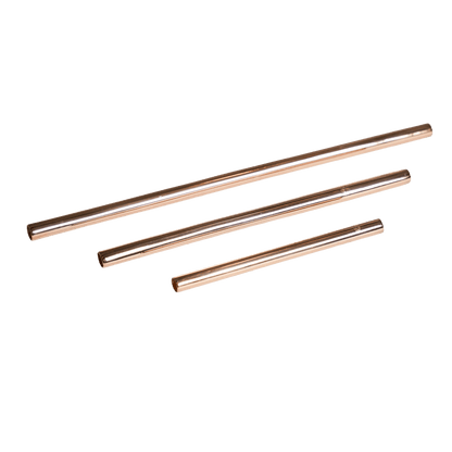 Three reusable rose gold-colored metal straws of varying lengths arranged diagonally on a white background