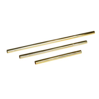 Three reusable gold-colored metal straws of varying lengths arranged diagonally on a white background